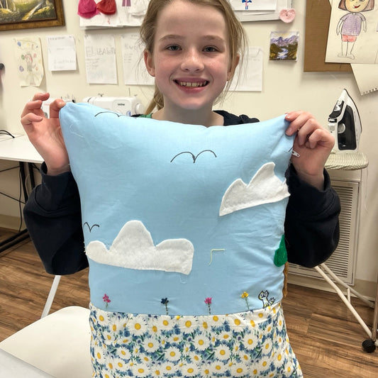 A student from Design and Sewing Academy is showing her beautiful project
